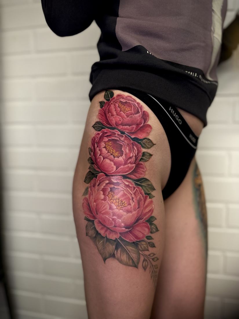 Pink peonies on the thigh